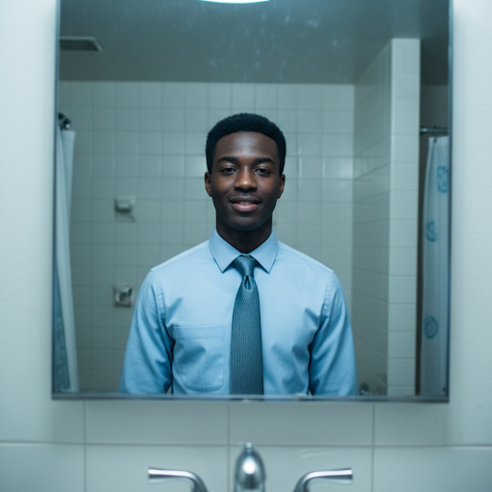 Bathroom selfie with harsh fluorescent lighting
